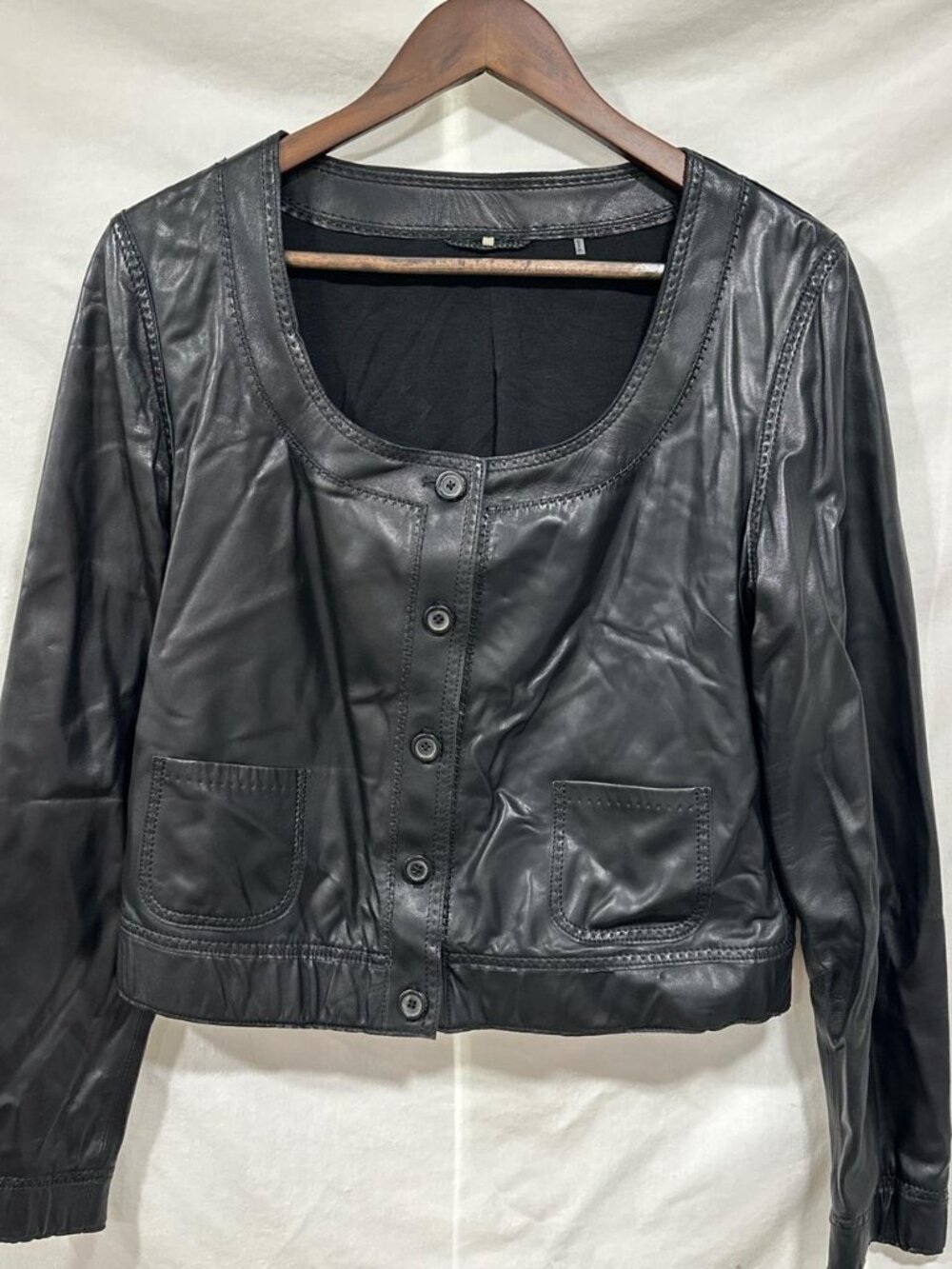 Black leather cropped button-up jacket with scoop neck